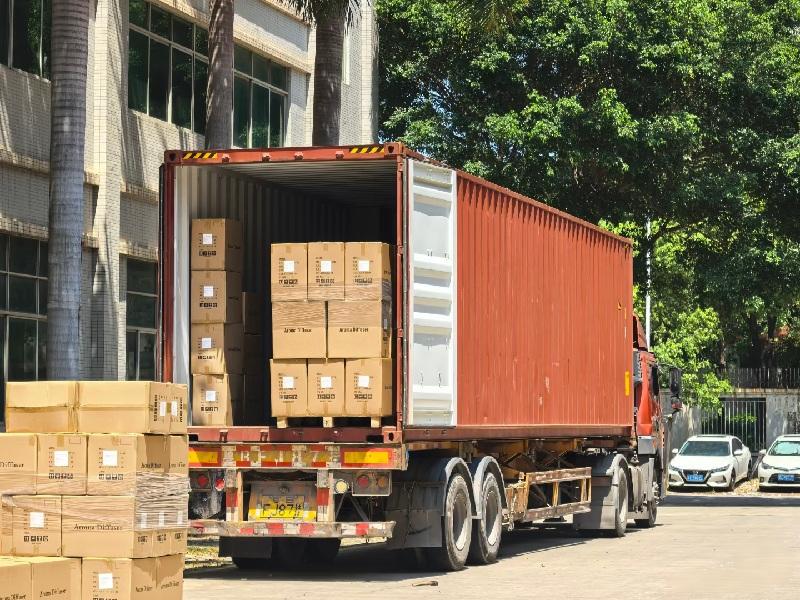 Bulk LED dance floor tiles loaded into a shipping container for global export.